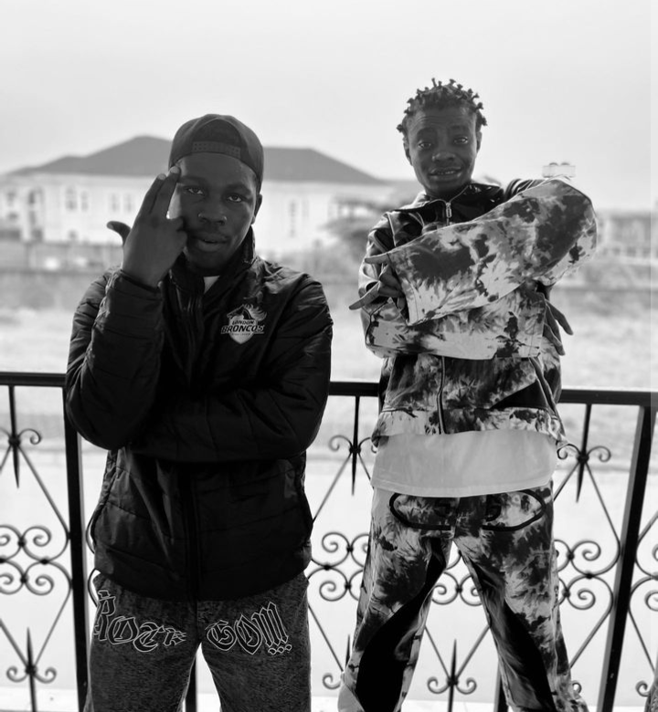 Capsdidit stands next to Afrobeat star artist for a photo take.png