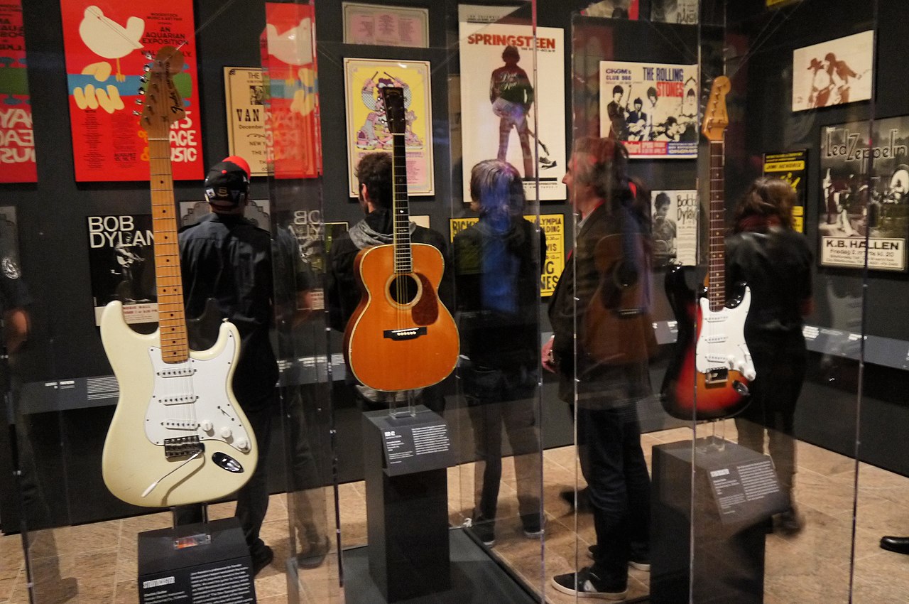 Jimi Hendrix's Fender Stratocaster (1968), Eric Clapton's C.F.Martin 000-42 (1939, serial no. 73234) played on 1992 MTV Unplugged, Bob Dylan's Fender Stratocaster (1964) - Play It Loud. MET (2019-05-13 19.45.53 by Eden, Janine and Jim).jpg
